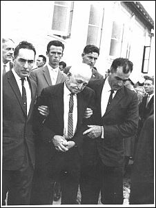 Paddy Partridge supported by his sons, Tom and Bob, at Frank's funeral, Alan Zammit in background